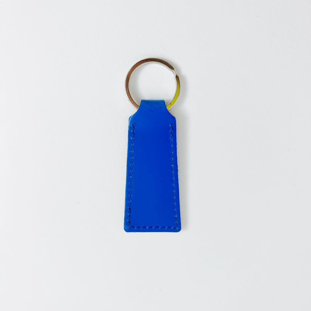 Papoutsi • Schlüsselanhänger Flach Neon Blau